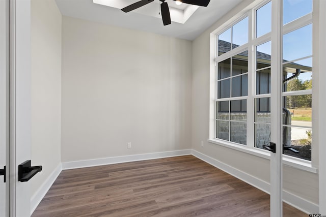 spare room with ceiling fan and dark hardwood / wood-style flooring