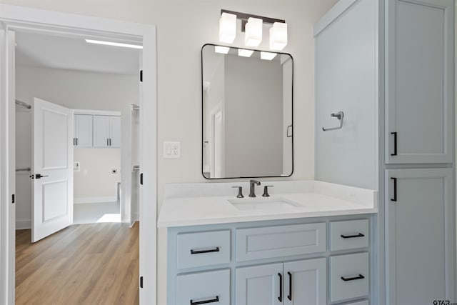 bathroom featuring vanity and hardwood / wood-style flooring