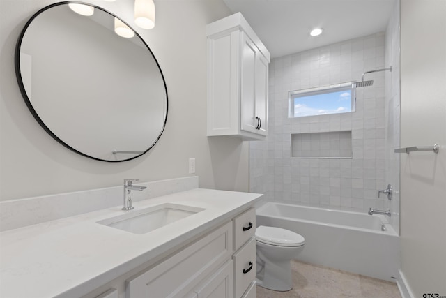 full bathroom featuring vanity, toilet, and tiled shower / bath