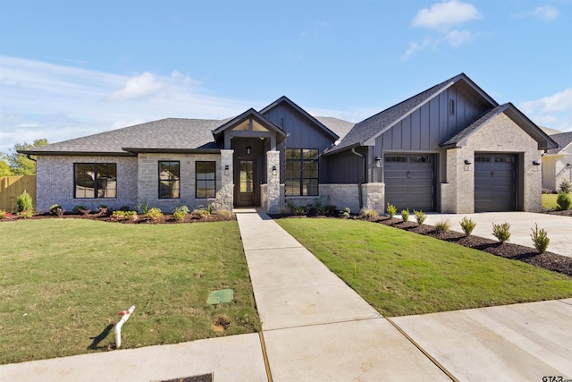 view of front facade featuring a garage and a front lawn