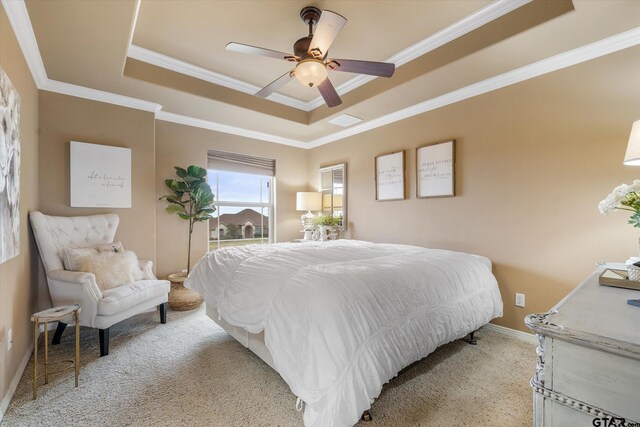 1299 Shadow Lks, Terrell, TX 75160 - bedroom featuring a raised ceiling, light colored carpet, crown molding, and ceiling fan