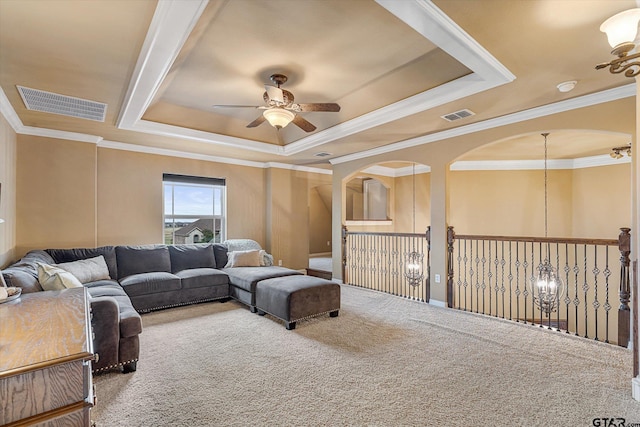 1299 Shadow Lks, Terrell, TX 75160 - carpeted living area featuring ceiling fan, a raised ceiling, and ornamental molding