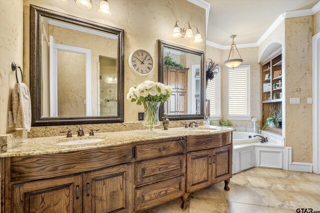 1299 Shadow Lks, Terrell, TX 75160 - bathroom with double vanity, a garden tub, and ornamental molding
