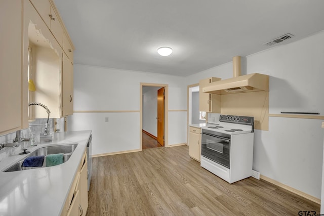 kitchen with sink, cream cabinets, light wood-type flooring, white electric range, and premium range hood