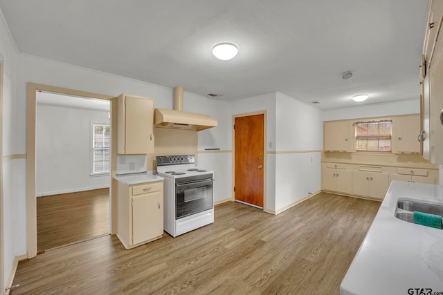 kitchen with cream cabinets, sink, ventilation hood, light wood-type flooring, and white electric range