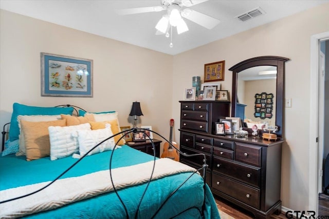 bedroom with hardwood / wood-style floors and ceiling fan