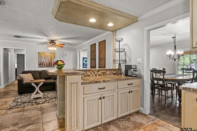 306 Dellwood Dr, Mount Pleasant, TX 75455 - kitchen featuring cream cabinets, a peninsula, crown molding, backsplash, and a ceiling fan