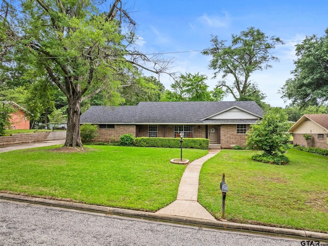 306 Dellwood Dr, Mount Pleasant, TX 75455 - ranch-style home featuring a front yard, brick siding, and roof with shingles