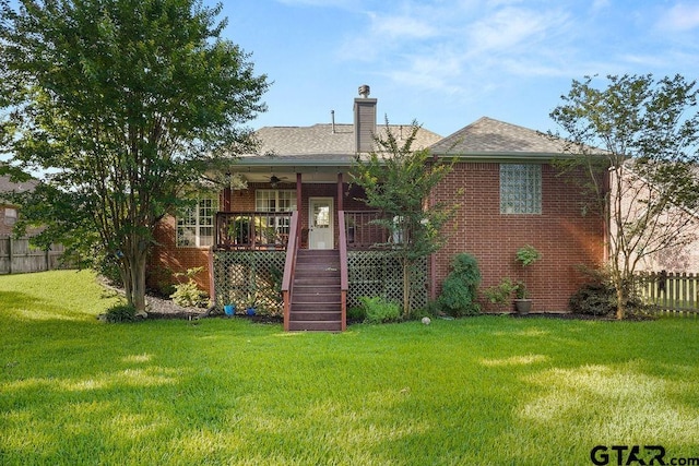 502 Northcreek Dr, Chandler, TX 75758 - view of front of home with ceiling fan, stairway, brick siding, a chimney, and roof with shingles