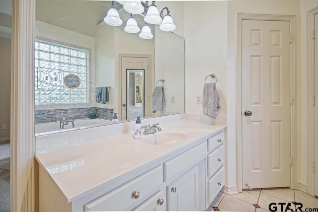 502 Northcreek Dr, Chandler, TX 75758 - bathroom featuring vanity, a chandelier, tile patterned flooring, and a bathtub