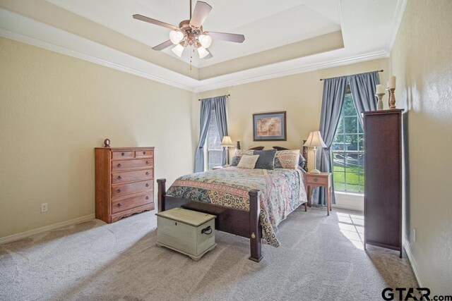 502 Northcreek Dr, Chandler, TX 75758 - bedroom with carpet floors, a raised ceiling, crown molding, ceiling fan, and baseboards