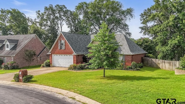 502 Northcreek Dr, Chandler, TX 75758 - view of front facade featuring brick siding, a garage, and driveway