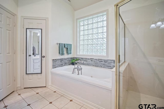 502 Northcreek Dr, Chandler, TX 75758 - full bath with a tub with jets, a shower stall, and tile patterned flooring