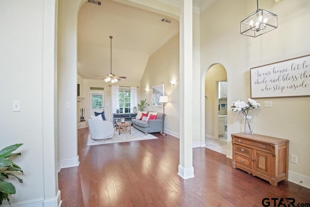 502 Northcreek Dr, Chandler, TX 75758 - living area featuring arched walkways, high vaulted ceiling, crown molding, wood finished floors, and a ceiling fan