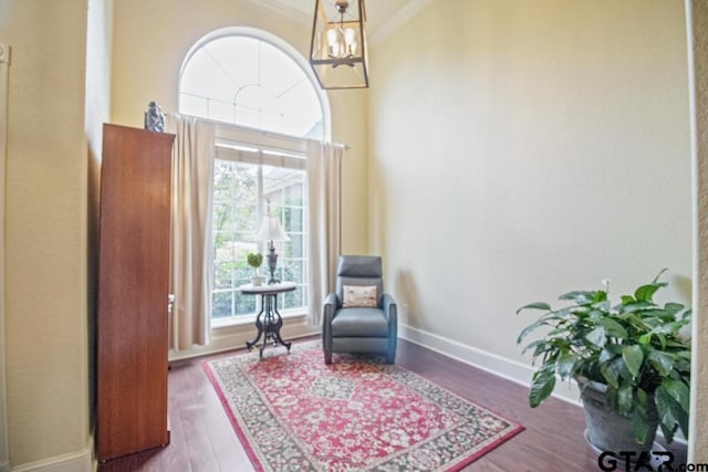 502 Northcreek Dr, Chandler, TX 75758 - sitting room with ornamental molding, wood finished floors, baseboards, and a chandelier