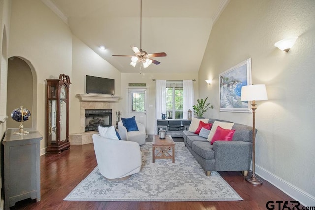 502 Northcreek Dr, Chandler, TX 75758 - living area featuring ceiling fan, dark wood-style floors, a tile fireplace, baseboards, and high vaulted ceiling