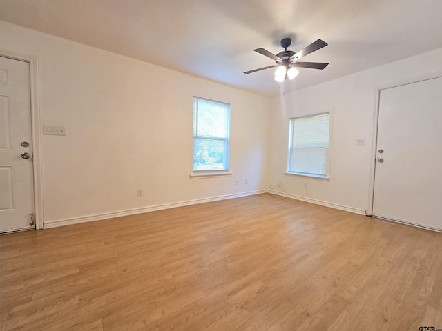 201 W Paschal St, Troup, TX 75789 - unfurnished room featuring light wood-type flooring, baseboards, and a ceiling fan