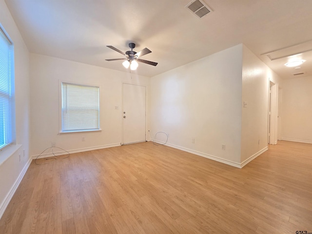 201 W Paschal St, Troup, TX 75789 - spare room featuring light wood-type flooring, ceiling fan, and baseboards