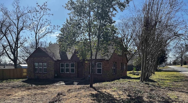 view of side of home with fence