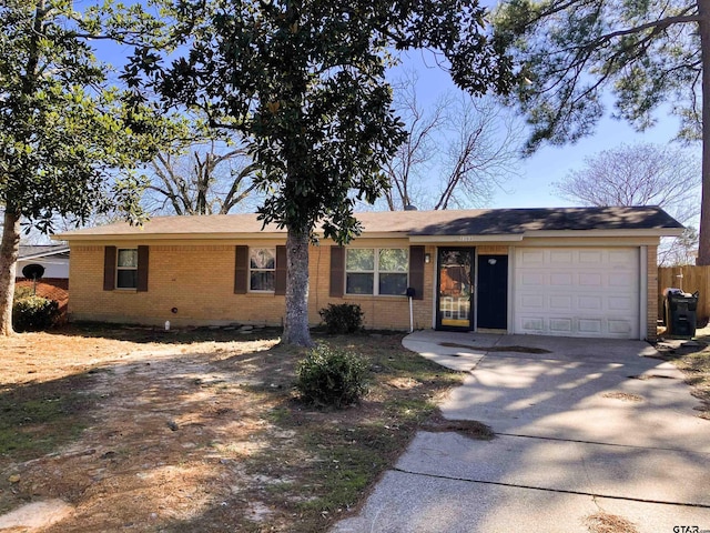 single story home featuring a garage