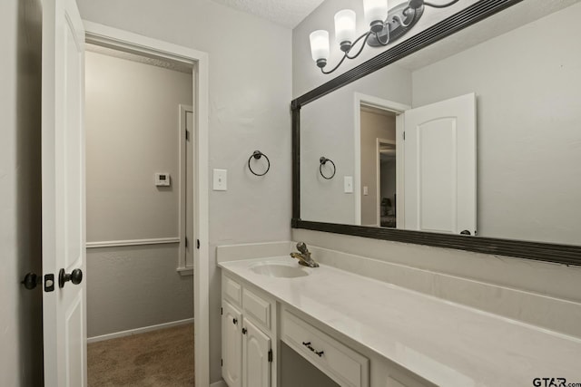 bathroom featuring vanity and a textured ceiling