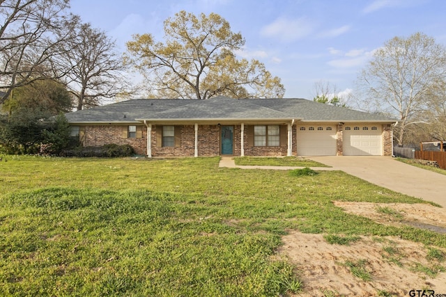 ranch-style house with a garage and a front lawn