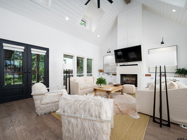 1555 Maple Crk, Tyler, TX 75703 - living room featuring high vaulted ceiling, wood finished floors, a fireplace, recessed lighting, and french doors