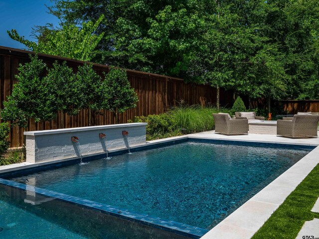 1555 Maple Crk, Tyler, TX 75703 - view of pool with outdoor lounge area and a fenced backyard