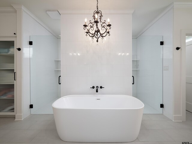 1555 Maple Crk, Tyler, TX 75703 - bathroom with tile patterned flooring, a freestanding bath, a stall shower, ornamental molding, and tile walls
