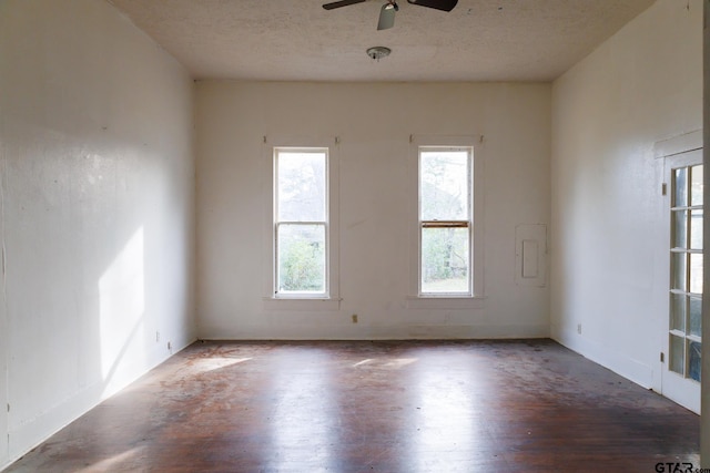 spare room with a textured ceiling and ceiling fan