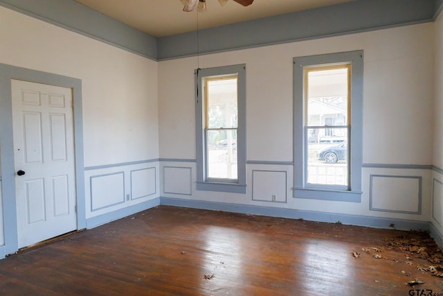 unfurnished room featuring ceiling fan and dark hardwood / wood-style flooring