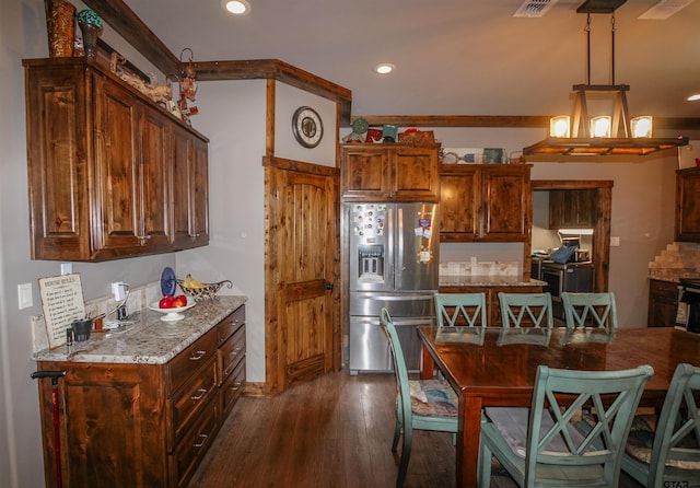 5000 Fm 315 S, Chandler, TX 75758 - kitchen with stainless steel refrigerator with ice dispenser, dark wood-type flooring, light stone countertops, recessed lighting, and decorative light fixtures