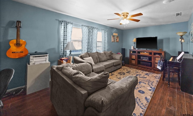 living room featuring dark hardwood / wood-style flooring and ceiling fan