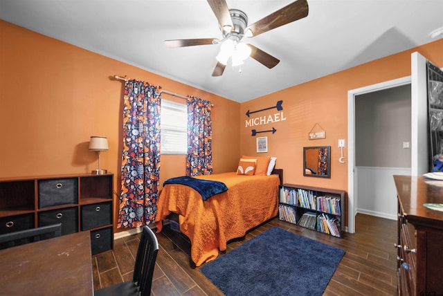 bedroom featuring ceiling fan and dark hardwood / wood-style flooring