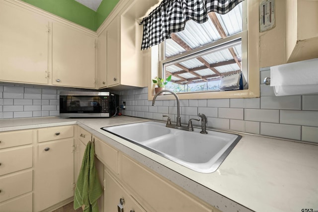 kitchen with sink and backsplash