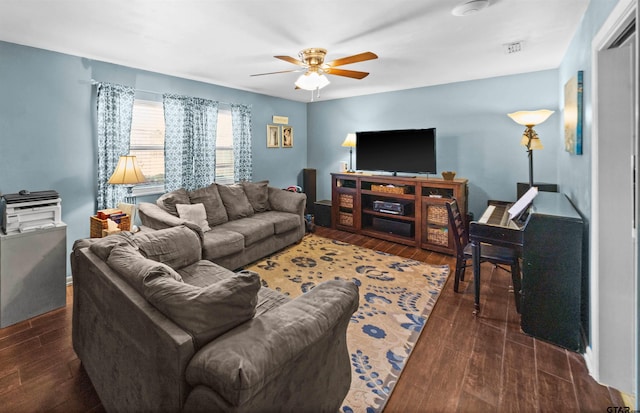 living room with dark hardwood / wood-style flooring and ceiling fan