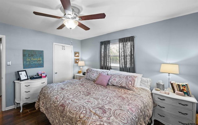 bedroom with dark wood-type flooring and ceiling fan