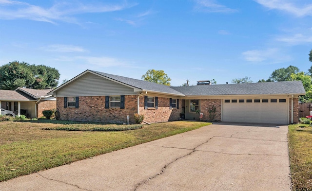 ranch-style home with a front lawn and a garage