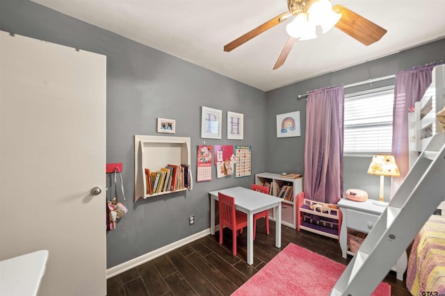 game room featuring dark hardwood / wood-style flooring and ceiling fan