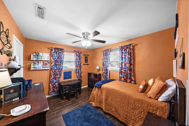 bedroom featuring ceiling fan and dark hardwood / wood-style flooring