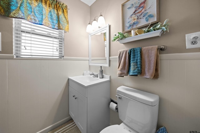 bathroom with toilet and vanity