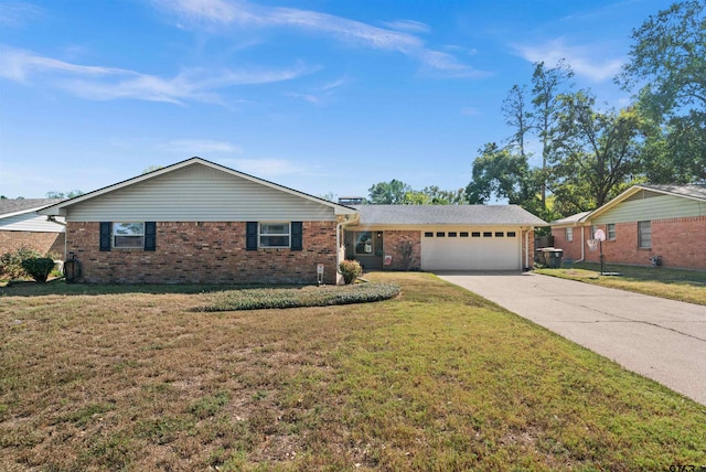 ranch-style house with a garage and a front lawn