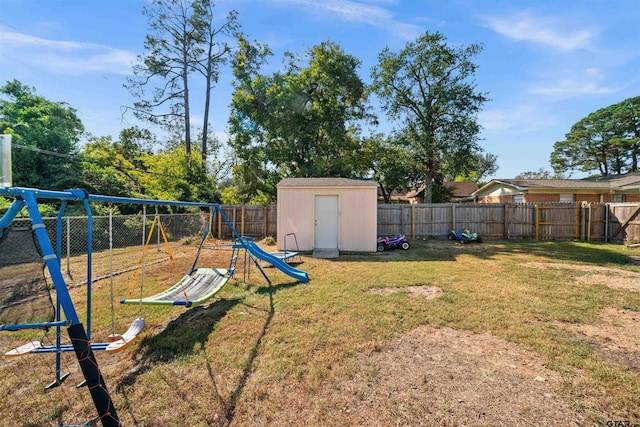 view of yard with a playground and a shed