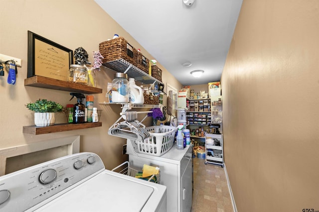 laundry area with washing machine and dryer