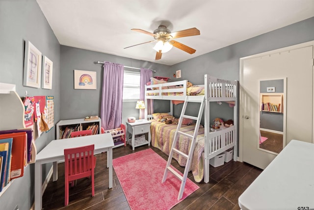 bedroom featuring dark hardwood / wood-style flooring and ceiling fan