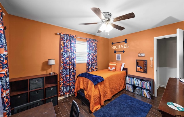 bedroom featuring ceiling fan and dark hardwood / wood-style floors