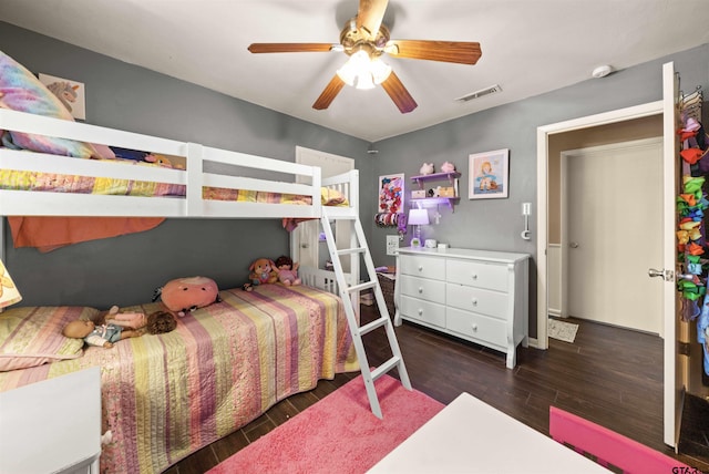 bedroom with dark wood-type flooring and ceiling fan