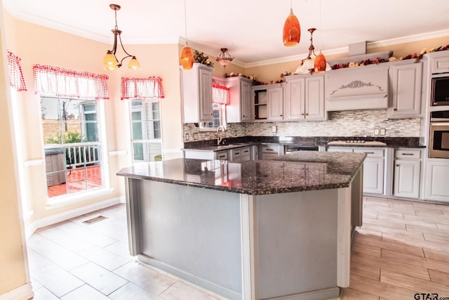 kitchen featuring open shelves, a sink, decorative backsplash, pendant lighting, and crown molding