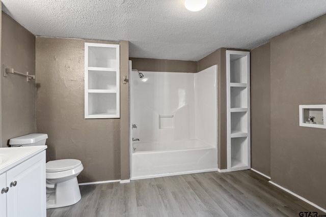 full bath with wood finished floors, a textured ceiling, and toilet