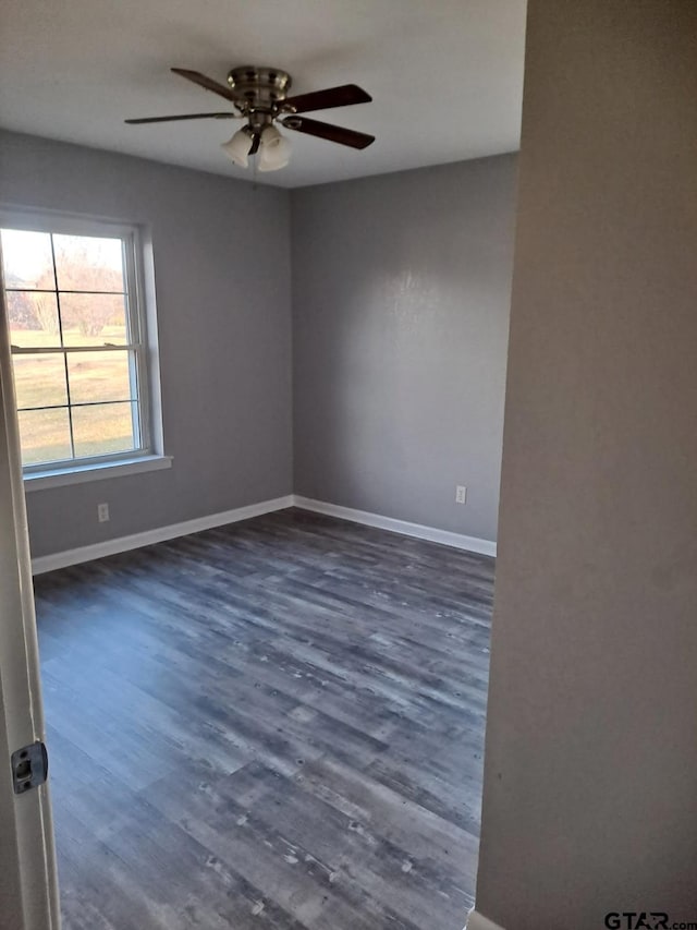3107 Hamilton Ln, Texarkana, TX 75501 - empty room featuring ceiling fan, dark wood finished floors, and baseboards